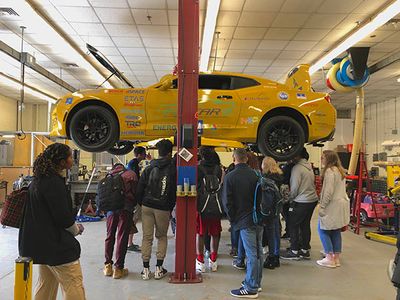 HSTA students touring the EcoCAR garage. 