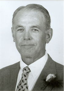 A headshot of Mr. Fred N. Mudge